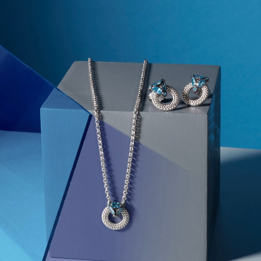 Delicate silver set jewelry embellished with Aqua blue stones.