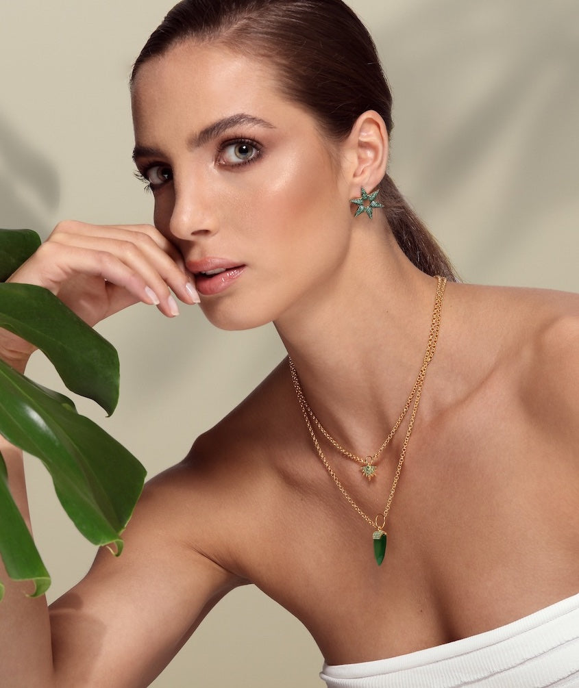 Adjustable double chain necklace adorned with green cultured Topaz stone.